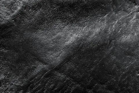 Genuine black leather background, pattern, texture. Bumpy, grained structure Stock-Fotos