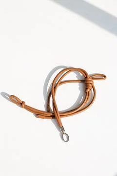 Genuine Leather Bag Strap with Unique Hand-Tied Knot Design in Brown Stock Photos