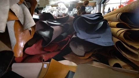 Genuine leather craftsmanship working on shelf in handmade shop Stock Footage 104018209