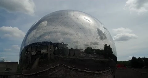 The Geode, a gleaming sphere 36 metres across containing a cinema Paris, France  Stock Footage 200401838
