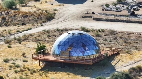 Geodesic dome being built rental unit during sunrise Stock Footage 292869311