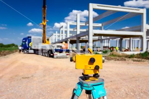 Geodesist device on tripod on a building site Stock Photos