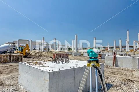 Geodesist device on tripod is connected with total station on a building site Stock Photos