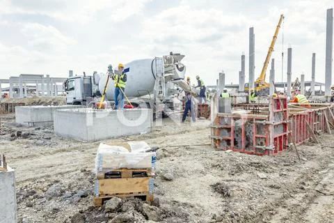 Geodesist is working with total station on a building site. Civil engineer .. Stock Photos