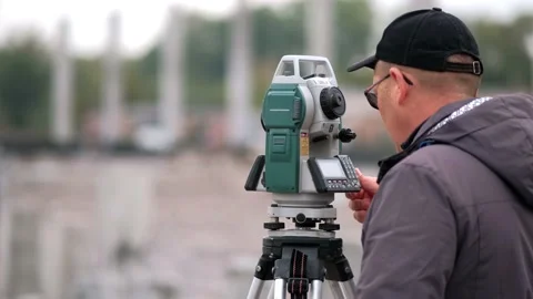 Geodesy: marking the territory using the Sokkia electronic total station  Stock Footage 164887533