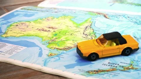 Geographic Australia map with yellow convertible car Stock Footage 88330535