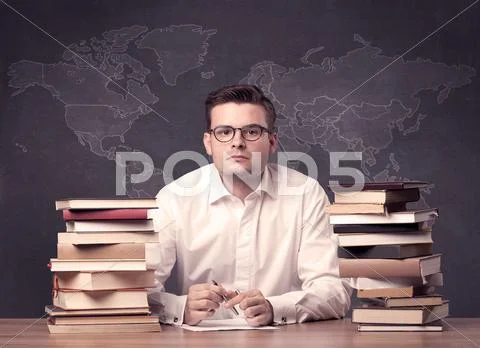 Geography teacher at desk Stock Photos
