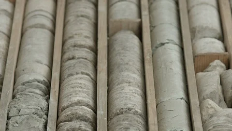 Geological borehole core samples stored in wooden box Video stock 123899195