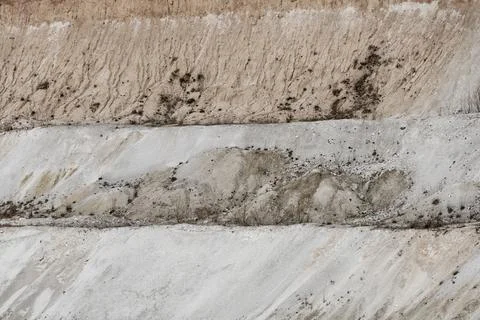 Geological cross-section of the soil. View of the sand mountain and various l Stock Photos