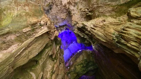 Geological Formations Inside A Deep Natural Cave With Blue Artificial Lighting Video stock 342214659