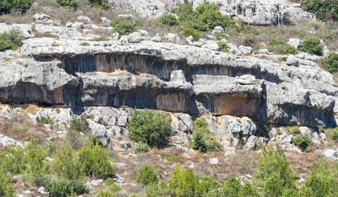 Geological solution notch formation in a limestone cliff Stock Photos