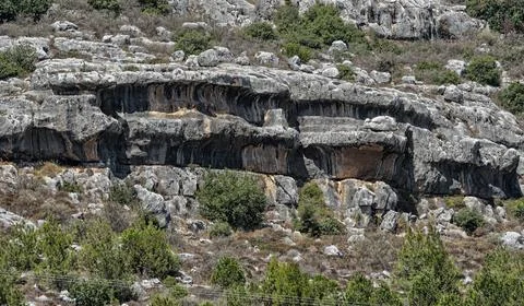 Geological solution notch formation in a limestone cliff Stock Photos