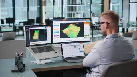 Geologist Examines 3D Subsurface Model Using Laptop Stock Footage 347281161