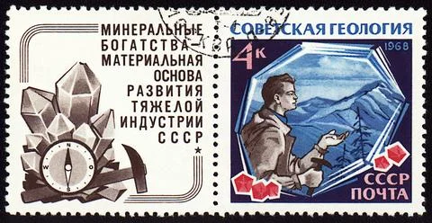 Geologist with hammer on post stamp Stock Photos