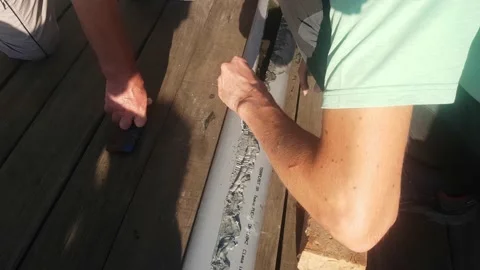 Geologist preparing drill pipe to take core samples for geological survey Stock Footage 138752393