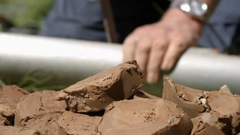 Geologist taking clay core samples out from drill pipe Video stock 123899309