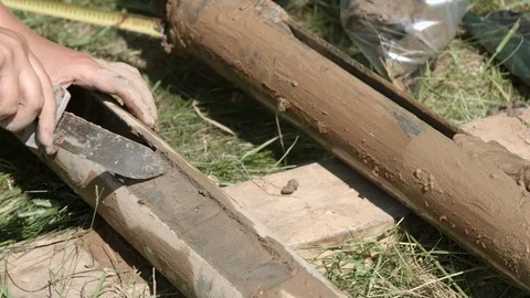 Geologist taking core samples out from drilling pipe for geological survey Video stock 123671836
