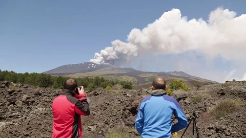 Geologist on Volcano Etna - Eruption with explosion and lava flow in Sicily Stock Footage 97538671