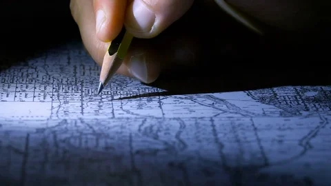 Geologist's hand marking on the map in the dark Stockbeeldmateriaal 78294191