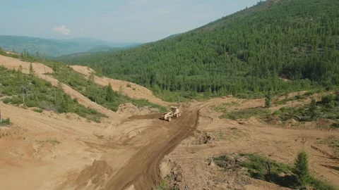 Geologists make the road. Pine forest in the mountains. Summer. Yakutia. Russia. Stock Footage 253985022
