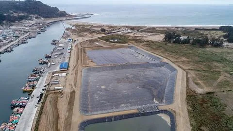 Geomembrane deployment and installation process with machinery in the const.. Stock Photos