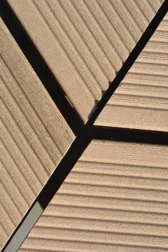 Geometric arrangement of grooved composite decking board planks Stock Photos