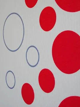Geometric background with red circles on beige paper. Stock Photos