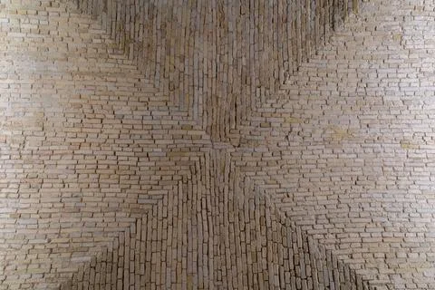 Geometric brick masonry pattern with symmetrical design Stock Photos