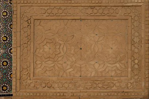 Geometric brickwork panel with star patterns on a historic building in Bukh.. Stock Photos