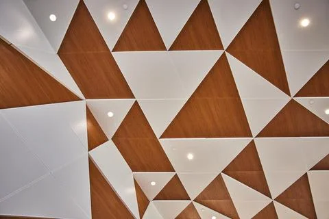 Geometric Ceiling Design with Triangular Panels and Recessed Lighting 写真素材