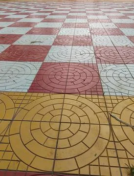 Geometric circle and square shape parking tiles yellow, red and white color.. Stock Photos