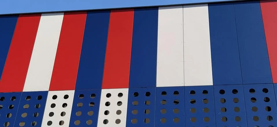 Geometric colored elements of the building facade with planes, lines and hole Stock Photos