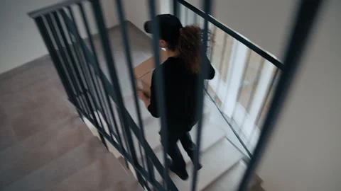 Geometric Composition of Courier on Stairs Video stock 322946775