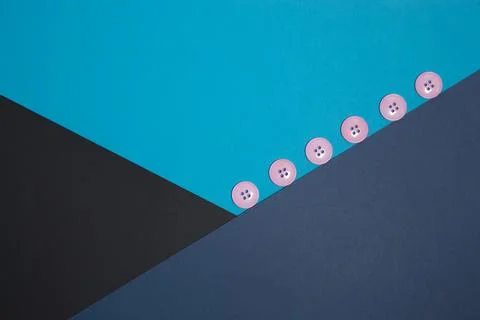 Geometric composition with pink buttons. Black, blue, blue paper. Crossing Stock Photos