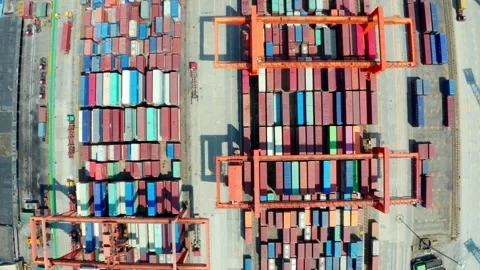 Geometric container stacks and crane frames seen from overhead in China Stock Footage 346438664