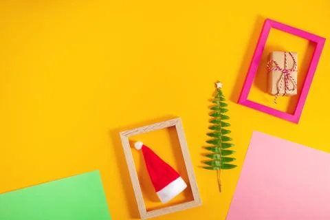 Geometric creative Christmas flat lay on colorful pastel trendy background. Stock Photos
