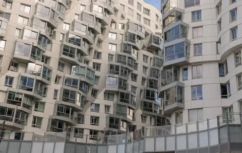 Geometric design on a modern building complex with repeating structure. Stock Photos