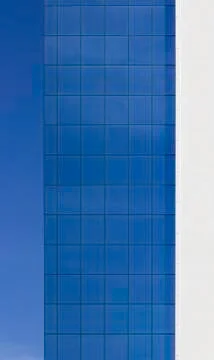 Geometric grid of windows on an office building Photos