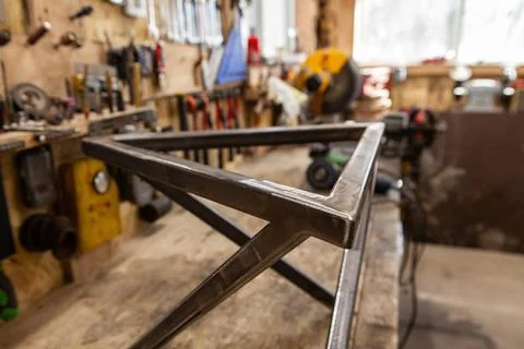 Geometric metal frame inside a workshop A closeup view on the triangular t... Foto stock
