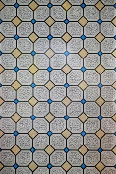 Geometric mosaic tile pattern with octagons and blue accents Stock Photos