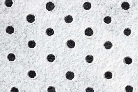 Geometric ornament with dots pattern from white flour sand, powder on table.  Foto stock