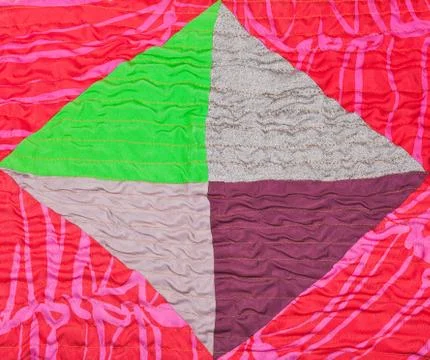Geometric ornament of silk patchwork quilt Stock Photos