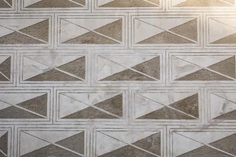 Geometric ornament on the wall. Sgraffito technique. Envelope facade. Stock Photos
