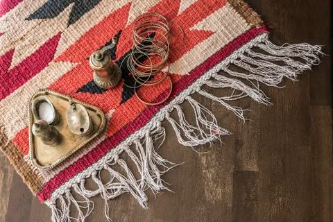 Geometric pattern carpet on wood surface Stock Photos