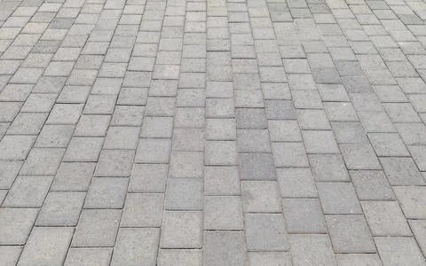 Geometric Pattern of Concrete Pavement with Grey Paving Stone Blocks Stock Photos