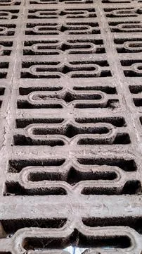 Geometric pattern etched into a concrete surface 库存照片