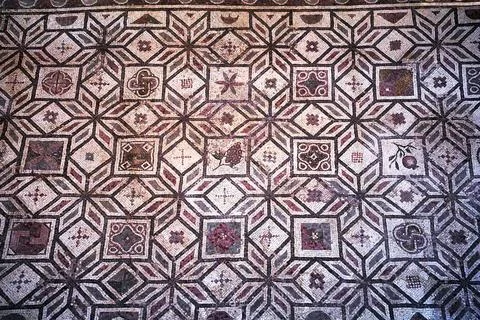 Geometric pattern of floor mosaic of an ancient house in Paphos town Stock Photos