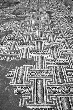 Geometric pattern of floor mosaic of an ancient house in Paphos town Stock Photos