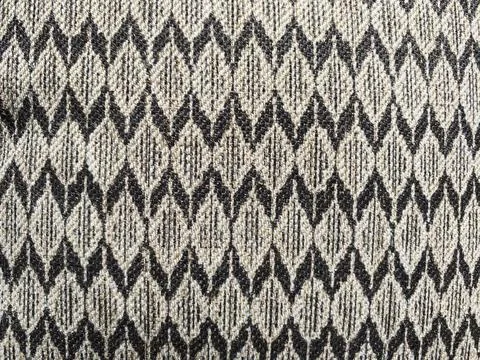 Geometric pattern, formed by the interplay of light and dark  weave. Stock Photos