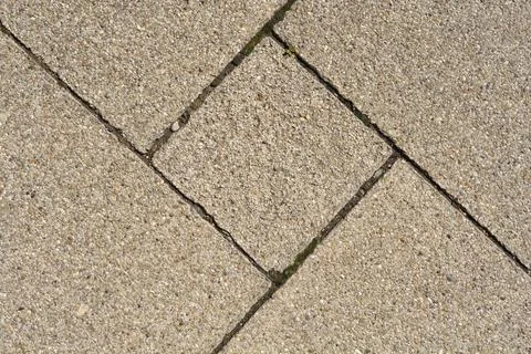Geometric pattern of gray concrete paving slabs Stock Photos